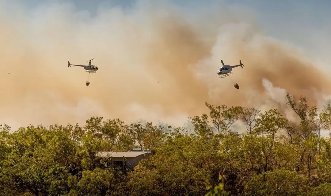 Helicopter B206 and R44 with Bucket at Wildfire